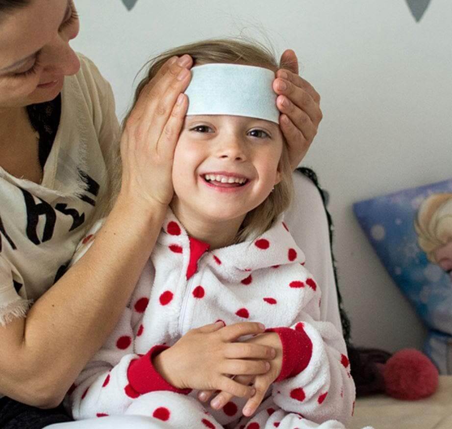 FeverMates fever cooling patch on a child's forehead